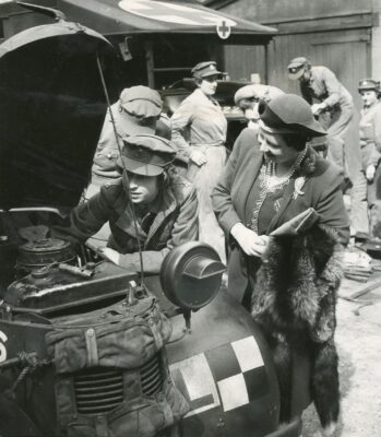 Nostalgia Princess Elizabeth explains to the Queen what she has done to the car engine. April, 1945.