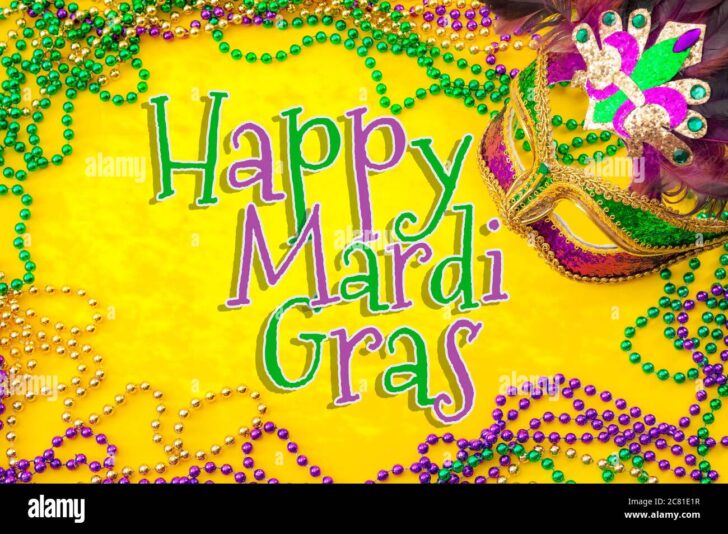 happy-mardi-gras-and-fat-tuesday-carnival-concept-theme-with-close-up-on-a-face-mask-full-of-color-feathers-and-texture-and-golden-green-and-purple-2C81E1R